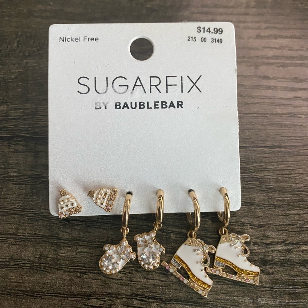 Fun winter hat, mittens and ice skate earrings.